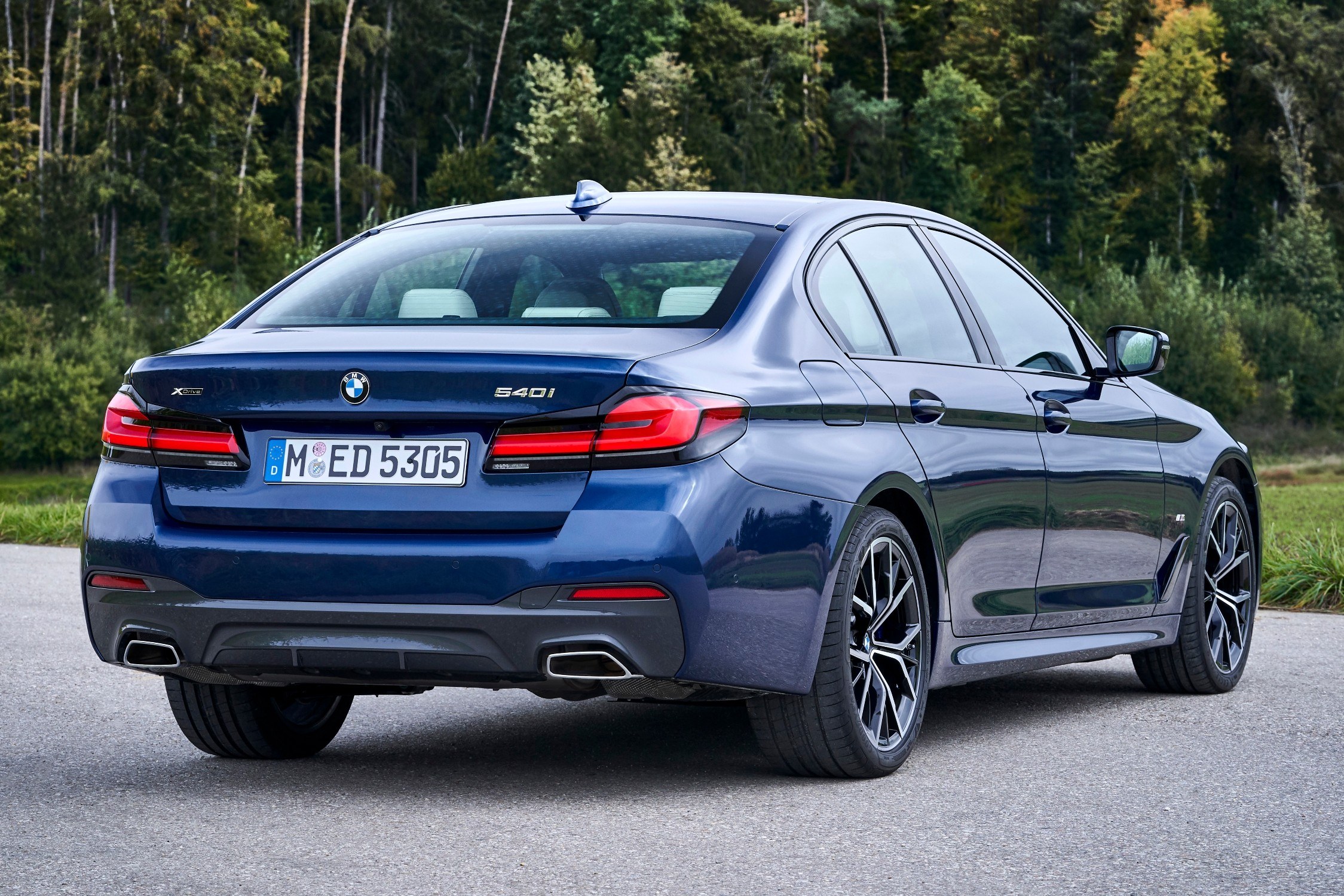 2021 BMW 540i xDrive Sedan in Phytonic Blue, rear three-quarter view, one of the models covered by recall 26V525