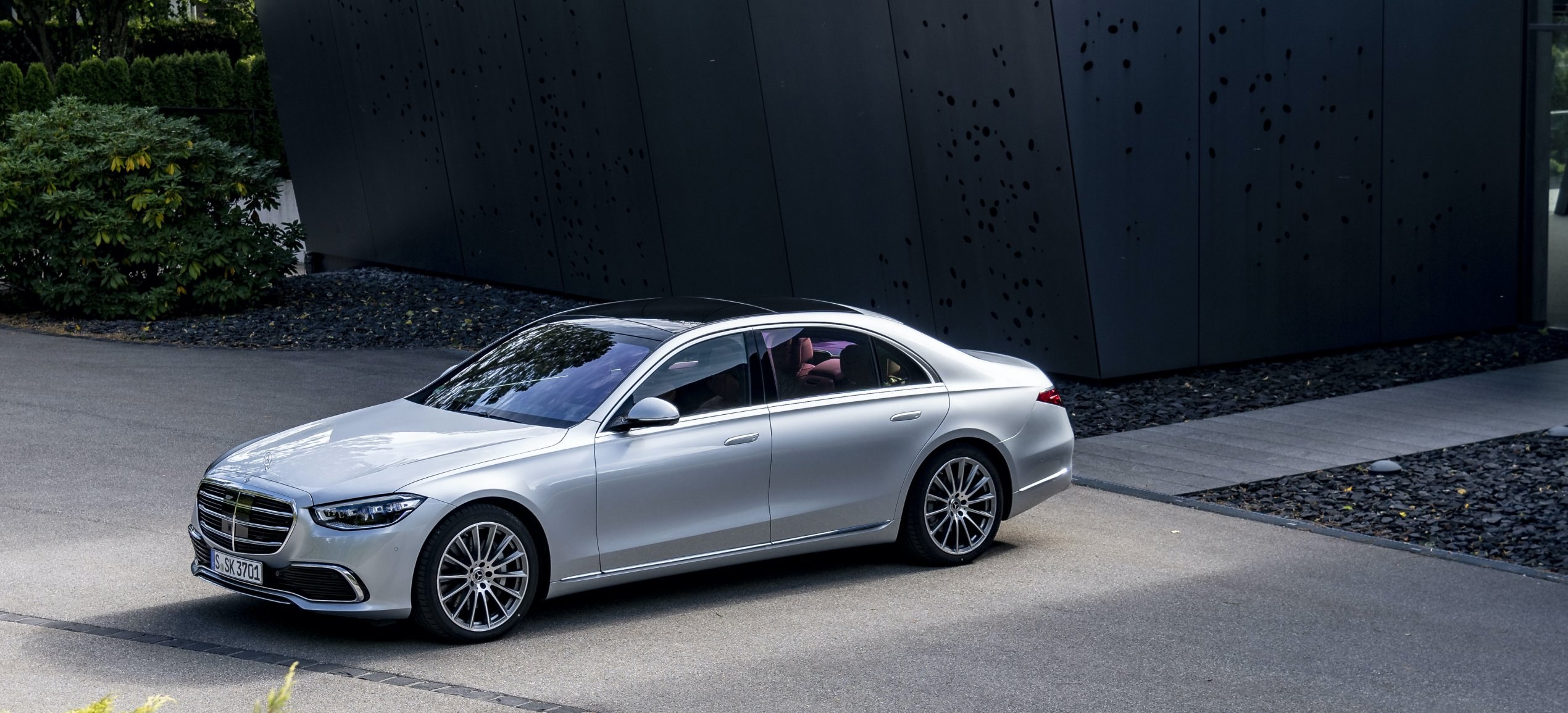 Silver Mercedes-Benz S-Class sedan of the 223 generation in front three-quarter view, European model shown, the body style covered by front brake hose recall 26V638000