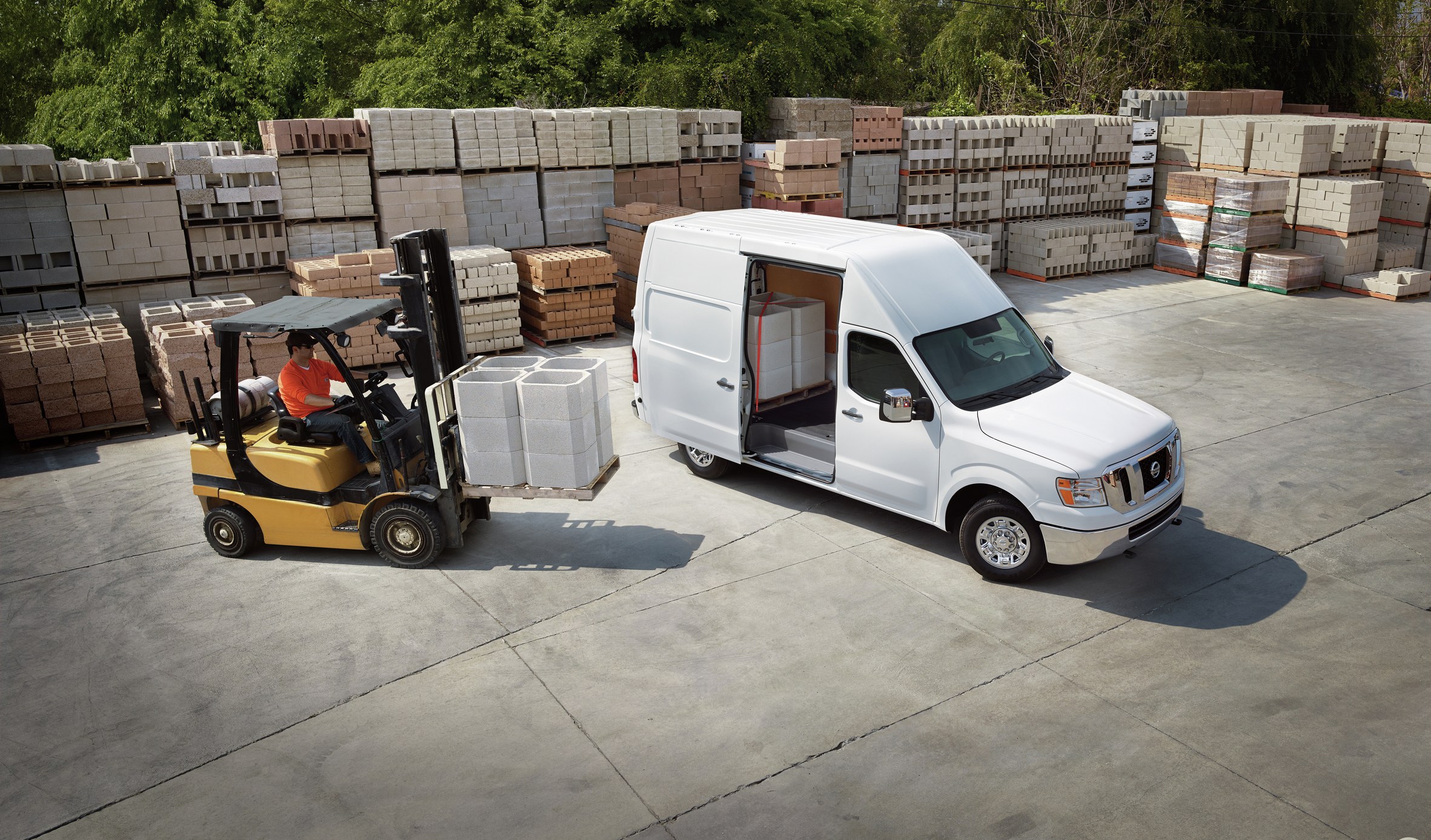 Nissan NV Cargo high-roof van at a loading yard, the same first-generation body style as the recalled 2012-2017 NV vans