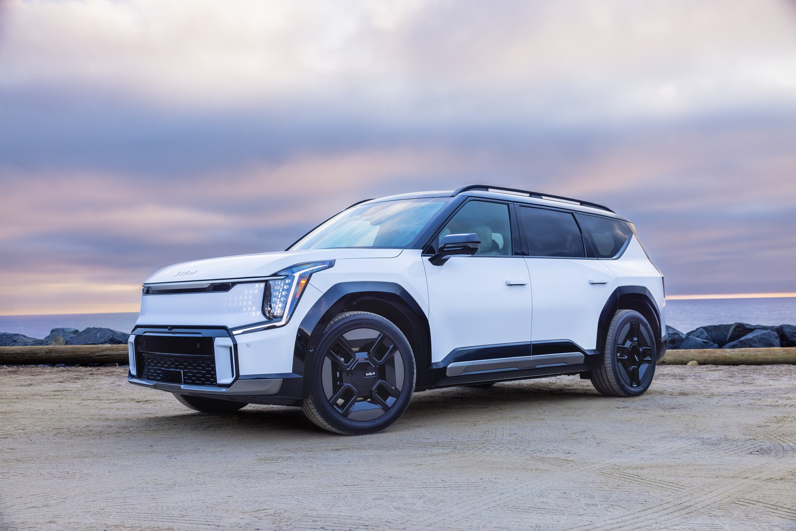 2026 Kia EV9 in white, front three-quarter view, the three-row electric SUV covered by recall 26V545