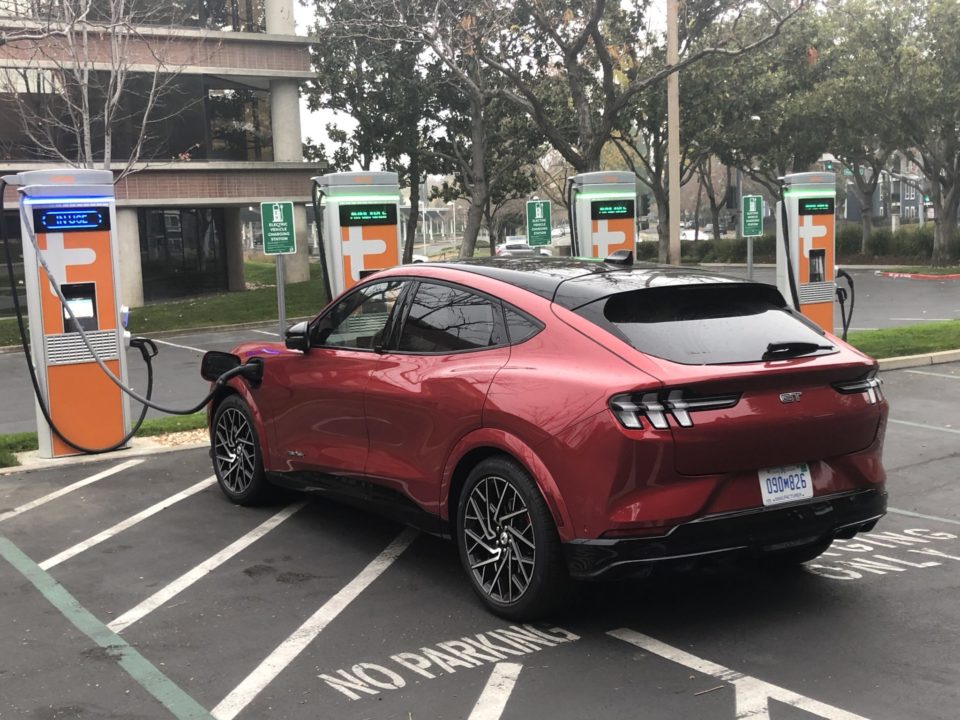 A Ford Mustang EV recharging at an electric vehicle station in Sacramento, California.