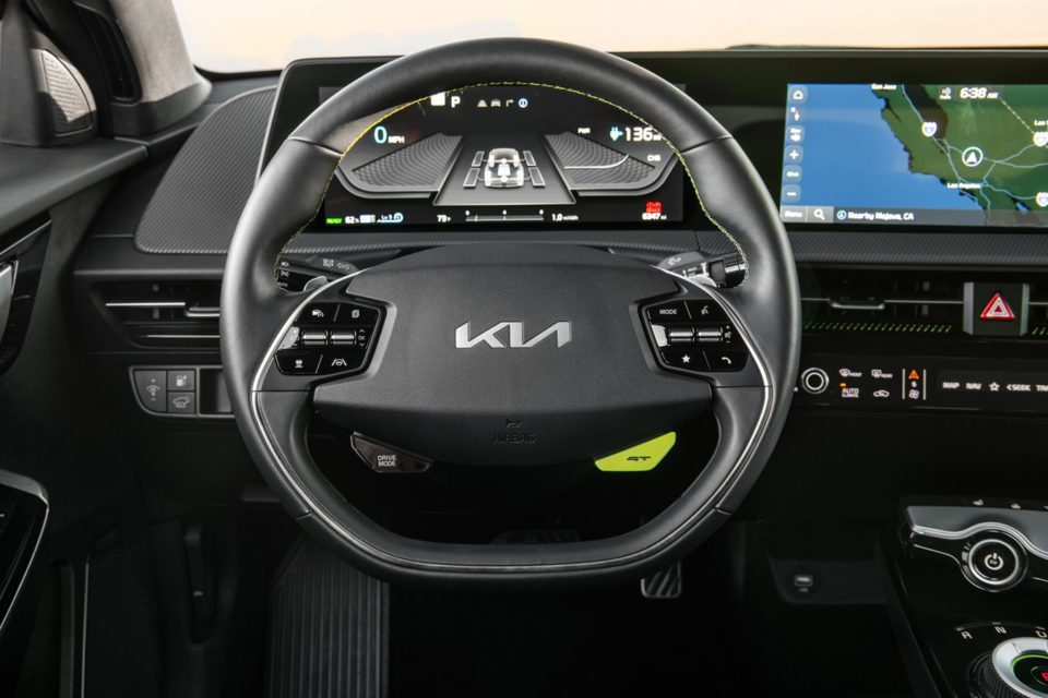The interior of the 2023 Kia EV6 prominently display the new KIa logo.