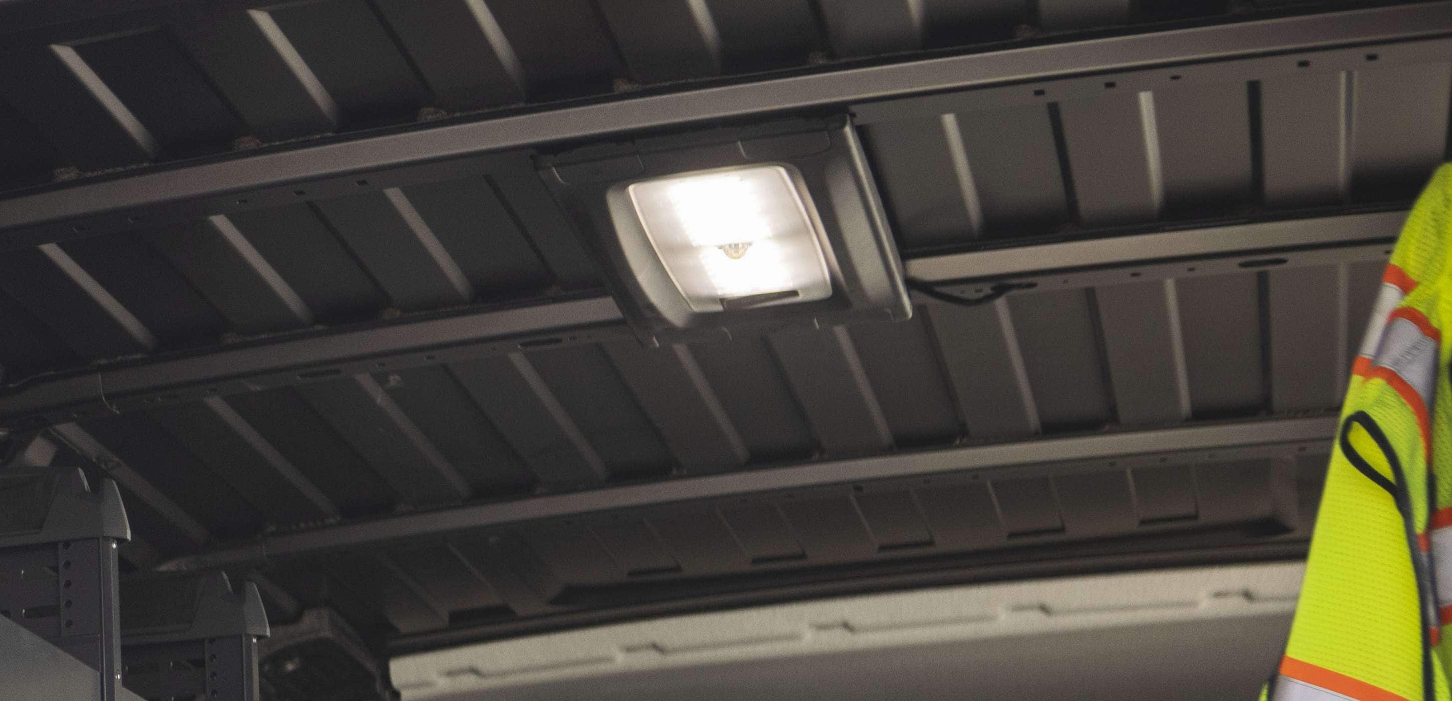 2025 RAM ProMaster cargo area with interior LED lighting illuminating the workspace