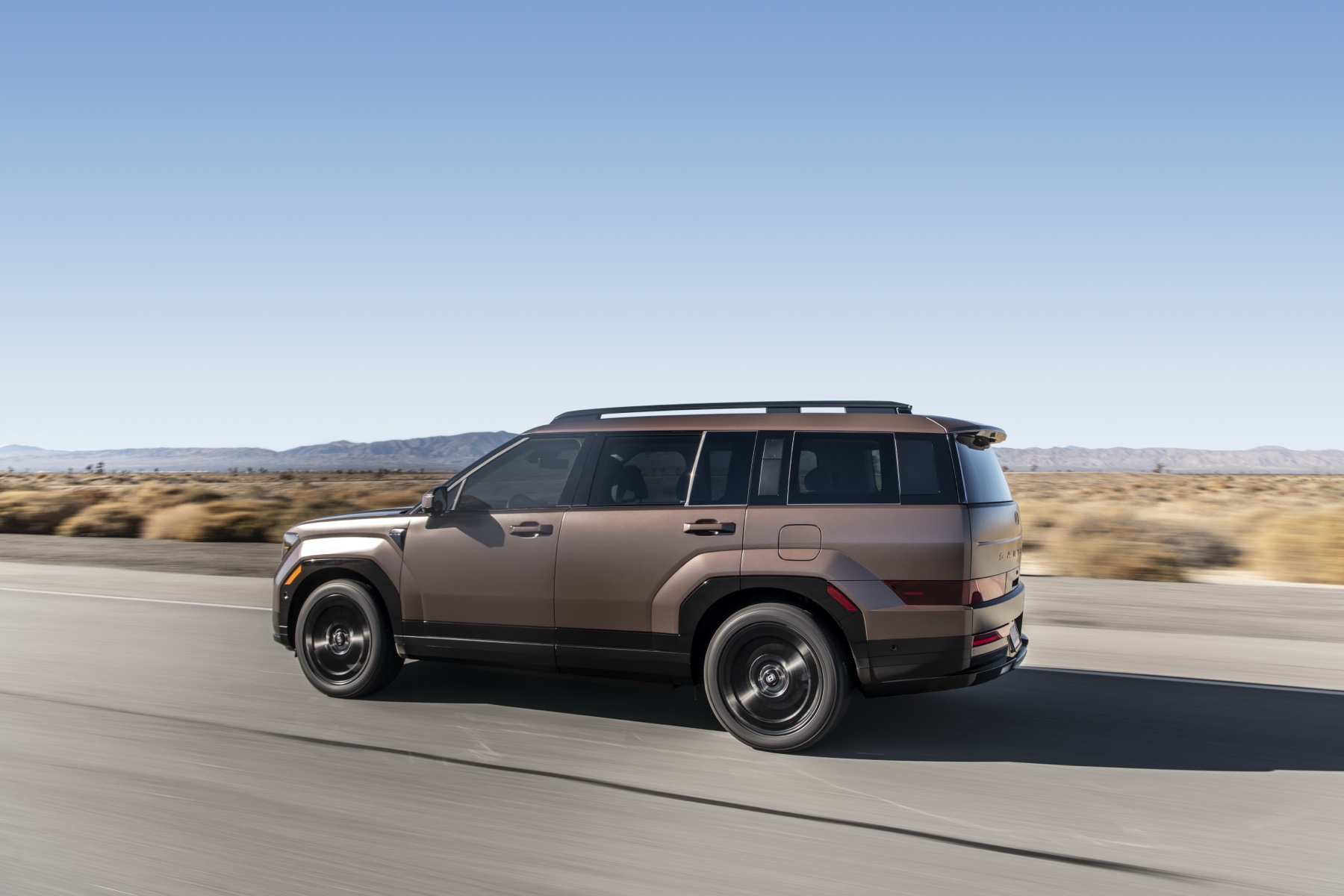 2026 Hyundai Santa Fe Hybrid in profile, showing boxy three-row SUV proportions