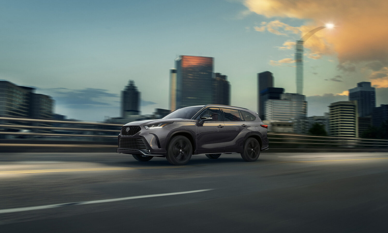 2026 Toyota Highlander hero exterior shot showing the redesigned three-row body