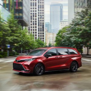 2026 Toyota Sienna XSE in red on a city street