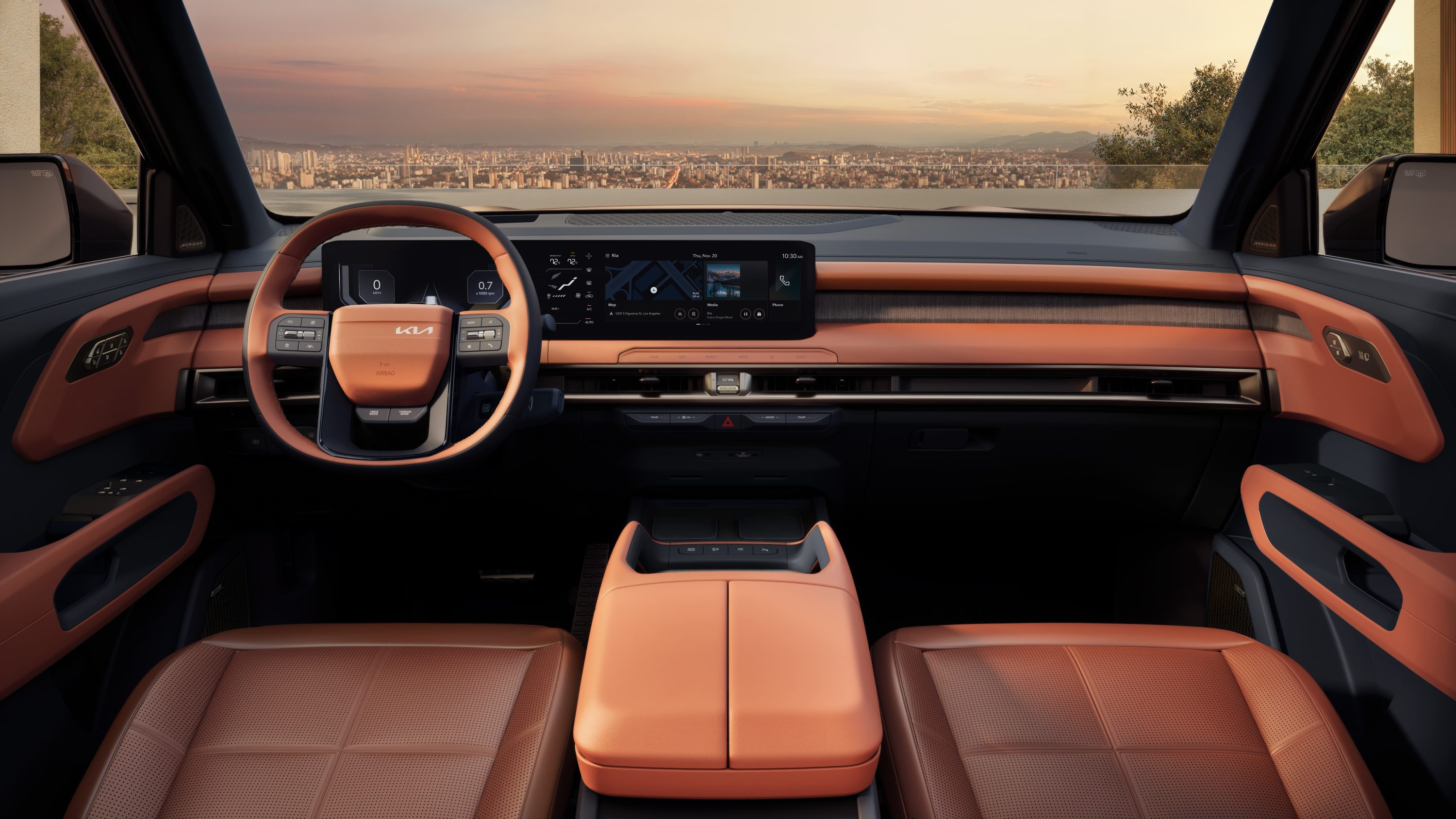 2027 Kia Telluride SX-Prestige interior showing dual 12.3-inch curved displays, wood trim, and cognac leather seats