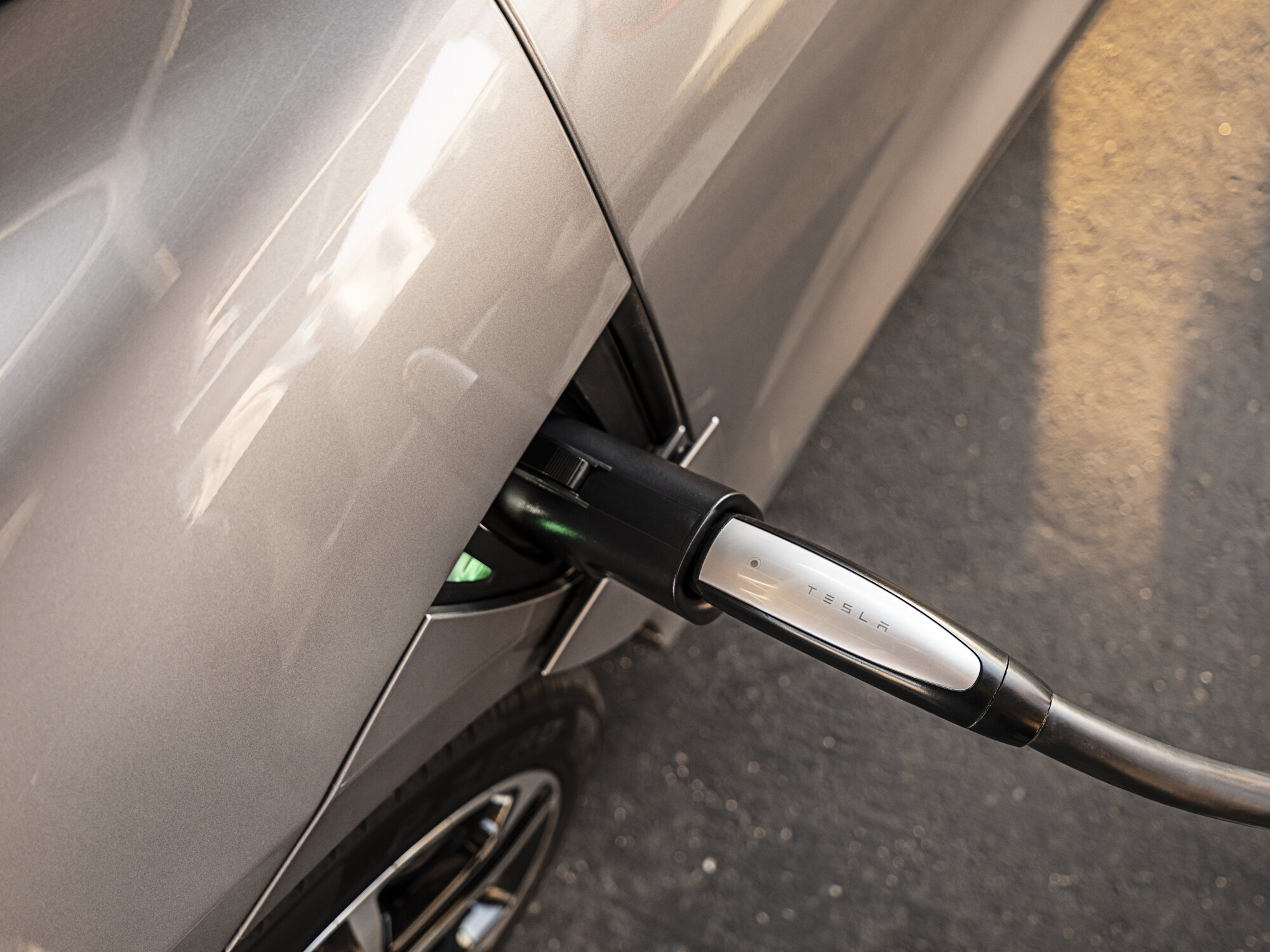 Lucid Air at Tesla Supercharger with NACS adapter