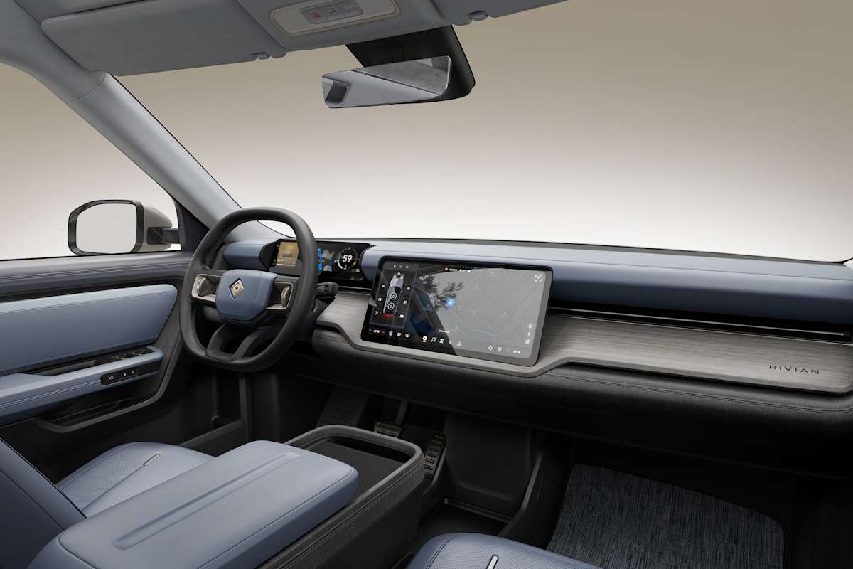 2026 Rivian R2 interior dashboard with slate blue trim, large touchscreen, and minimalist cockpit design