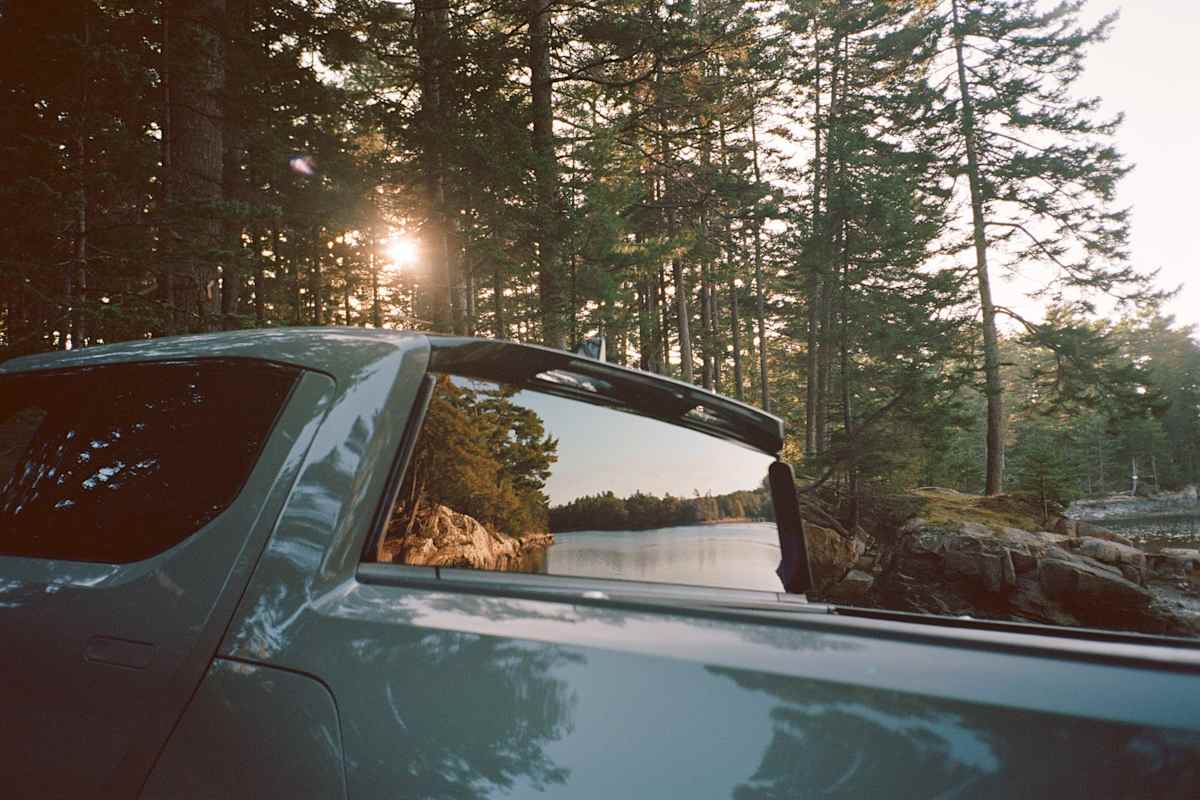 Rivian Reliability in 2026: What Three Years of R1T and R1S Owner Data Shows 2 2026 Rivian R1T driving through sunlit forest road