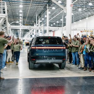 Rivian employees celebrate first customer R2 rolling off the line at Normal, Illinois plant, April 2026