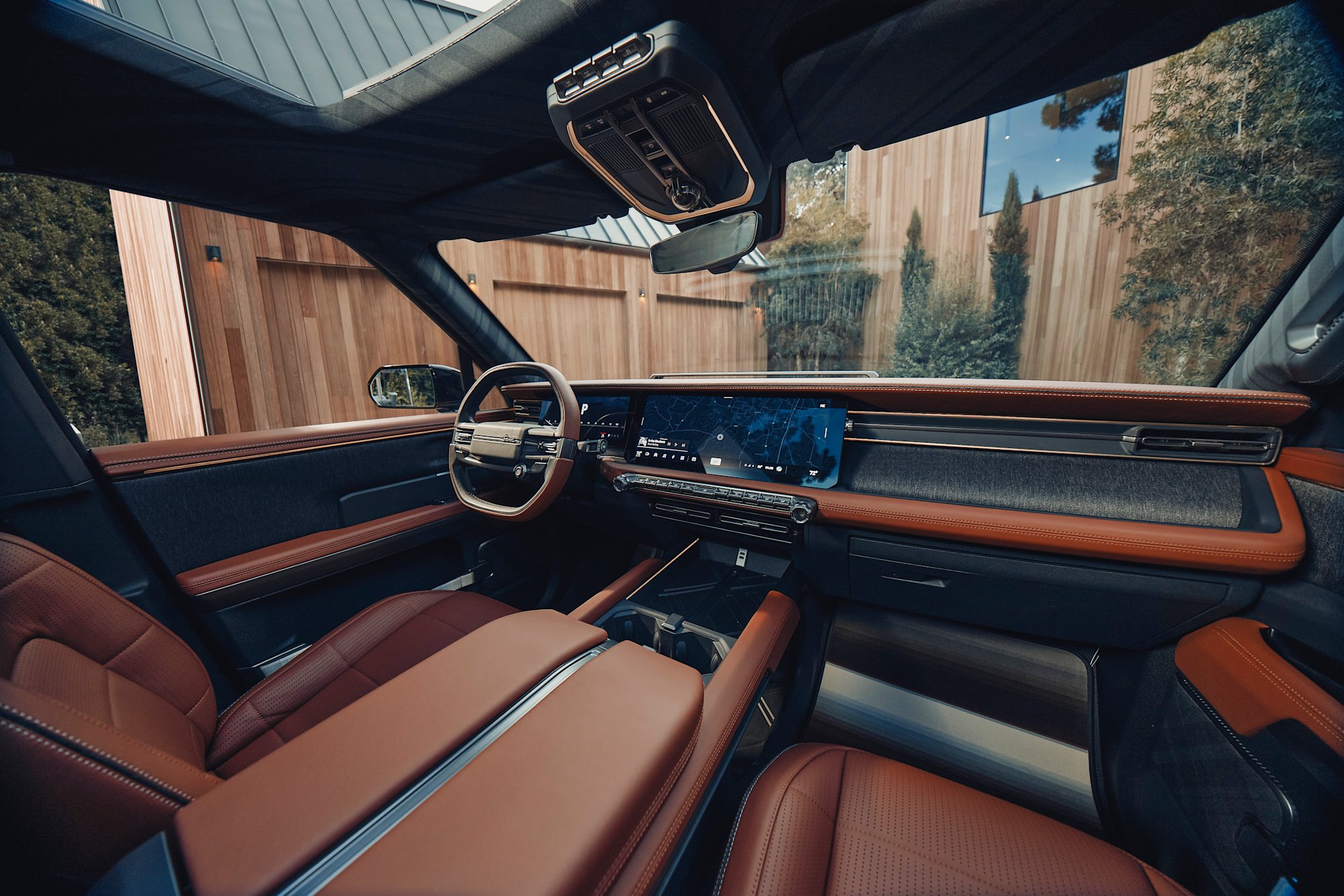 Scout Traveler interior with brick-red leather captain chairs and full dashboard view