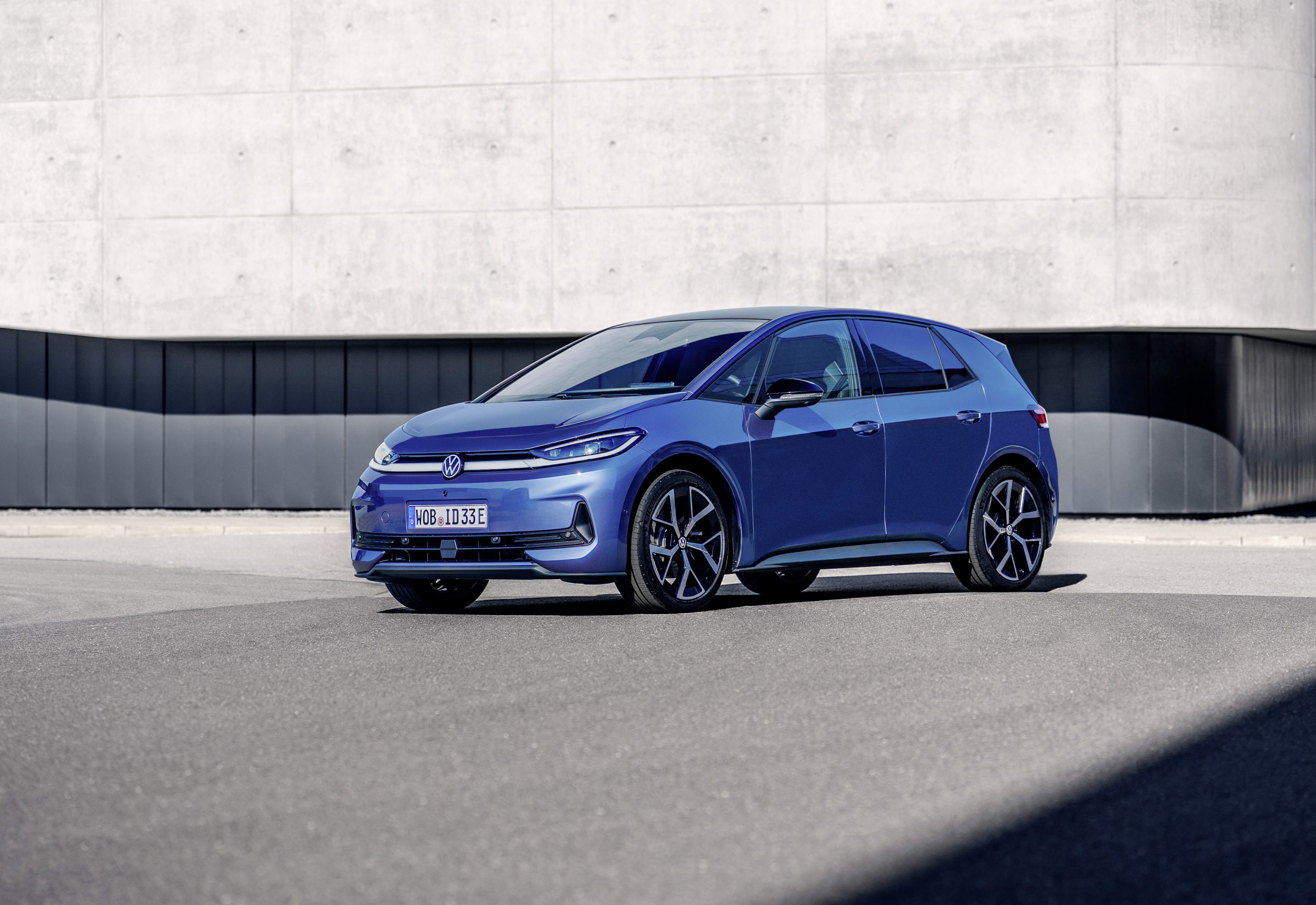2026 Volkswagen ID.3 Neo in deep blue photographed outdoors against concrete architecture