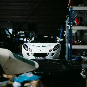 Classic car parked in a dim garage vulnerable to winter rodent damage to wiring
