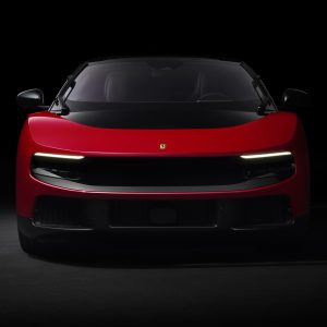 2026 Ferrari Luce in studio lighting with headlights illuminated, showing the transparent front light panel design