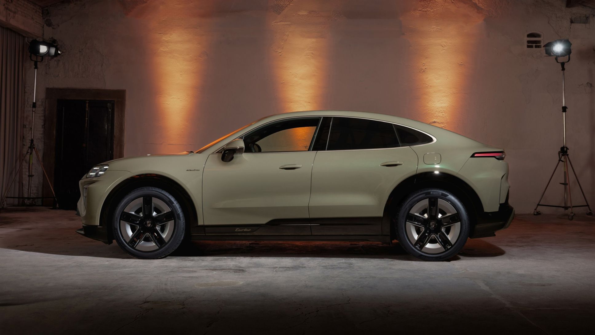 2026 Porsche Cayenne Turbo Coupé Electric in studio side profile, the BEV flagship of the Cayenne lineup with up to 1,139 horsepower and 2.4-second 0-60