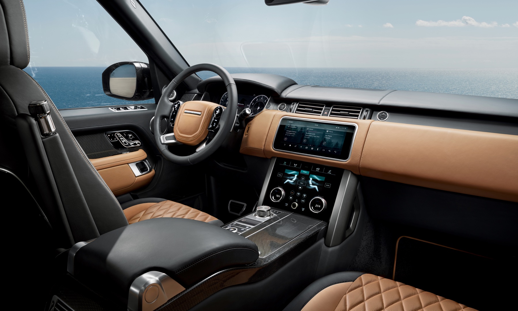 Range Rover SV Autobiography Ultimate cabin interior with semi-aniline leather seating, bespoke veneer, and rear-seat executive-class layout, illustrating the chauffeured-rear-seat experience the LWB 5-seat is built around