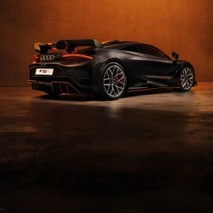 McLaren 788HS rear three-quarter view in carbon black with orange accents