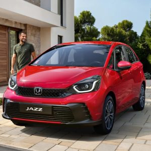 A red 2026 Honda Jazz, sold as the Fit in Japan, the subcompact hatchback Honda no longer offers in the US