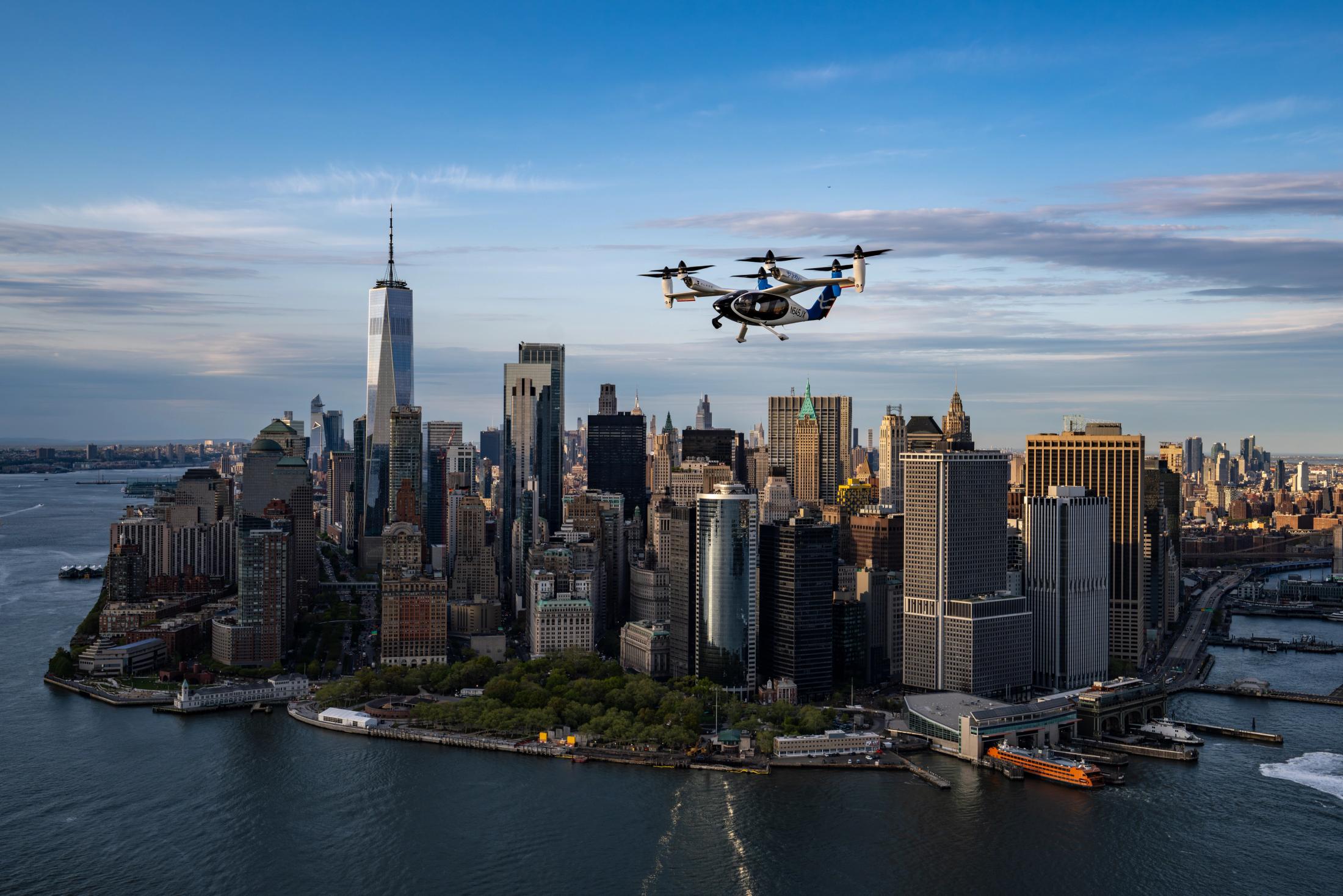 Toyota Took 51% of Building Joby's Air Taxi. It's the Hybrid Playbook, Aimed at the Sky 4 Joby S4 electric air taxi flying over Lower Manhattan with One World Trade Center in the background during the company's New York City flight campaign