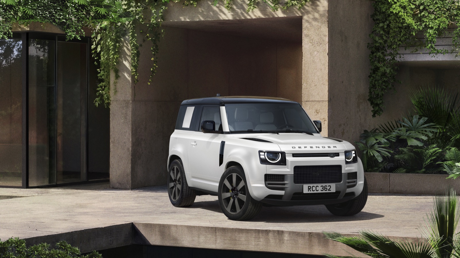 2027 Land Rover Defender 90 Vertex in Patagonia White matte wrap, showing the larger grille and body-colored front bumper