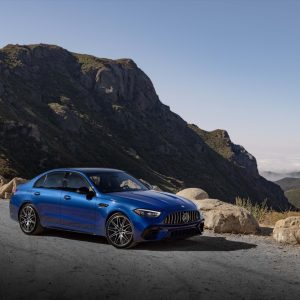 A blue Mercedes-AMG C 63 S E Performance parked on a mountain road, the four-cylinder plug-in hybrid being replaced by an inline-six