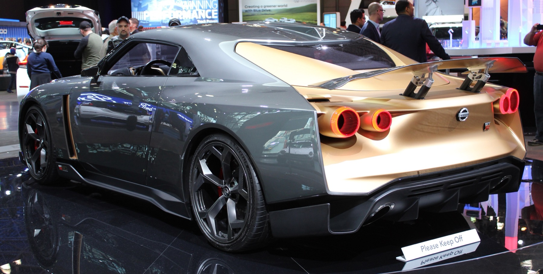 Rear three-quarter view of the grey and gold Nissan GT-R50 by Italdesign concept with round taillights