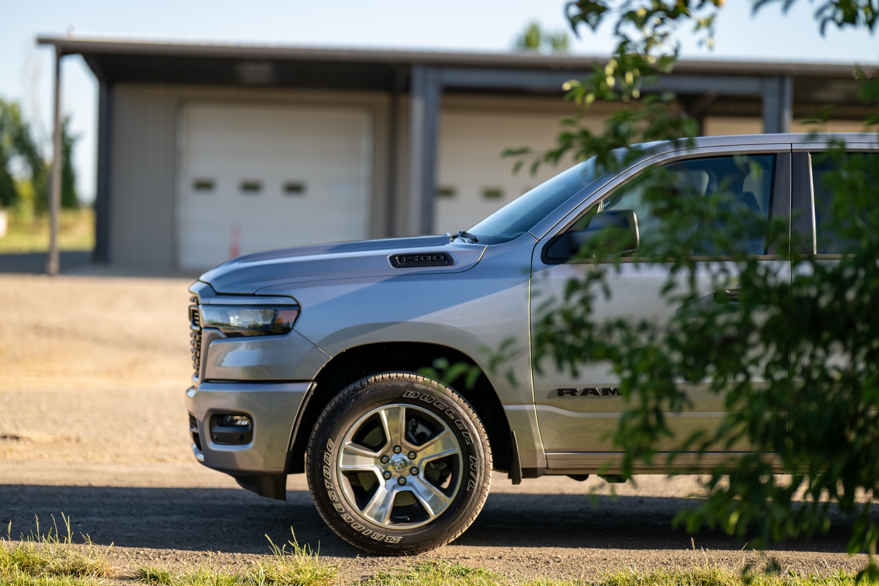 2026 RAM 1500 Express Billet Silver: Front three-quarter, work-site backdrop