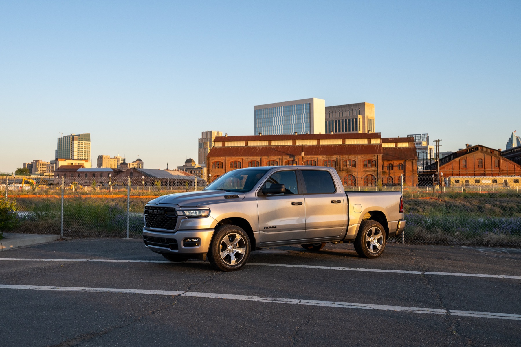 2026 RAM 1500 vs Ford F-150: The Work-Spec Truth 2 2026 RAM 1500 Express in Billet Silver Metallic, front three-quarter at golden hour