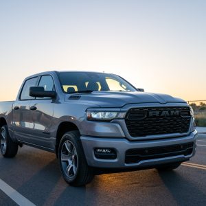 2026 RAM 1500 Express in Billet Silver Metallic, front three-quarter on an urban road