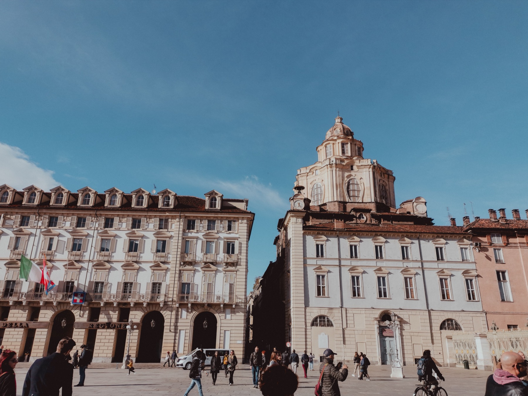 Pedestrians crossing Piazza Castello in central Turin, the public square that hosts Salone Auto Torino each September