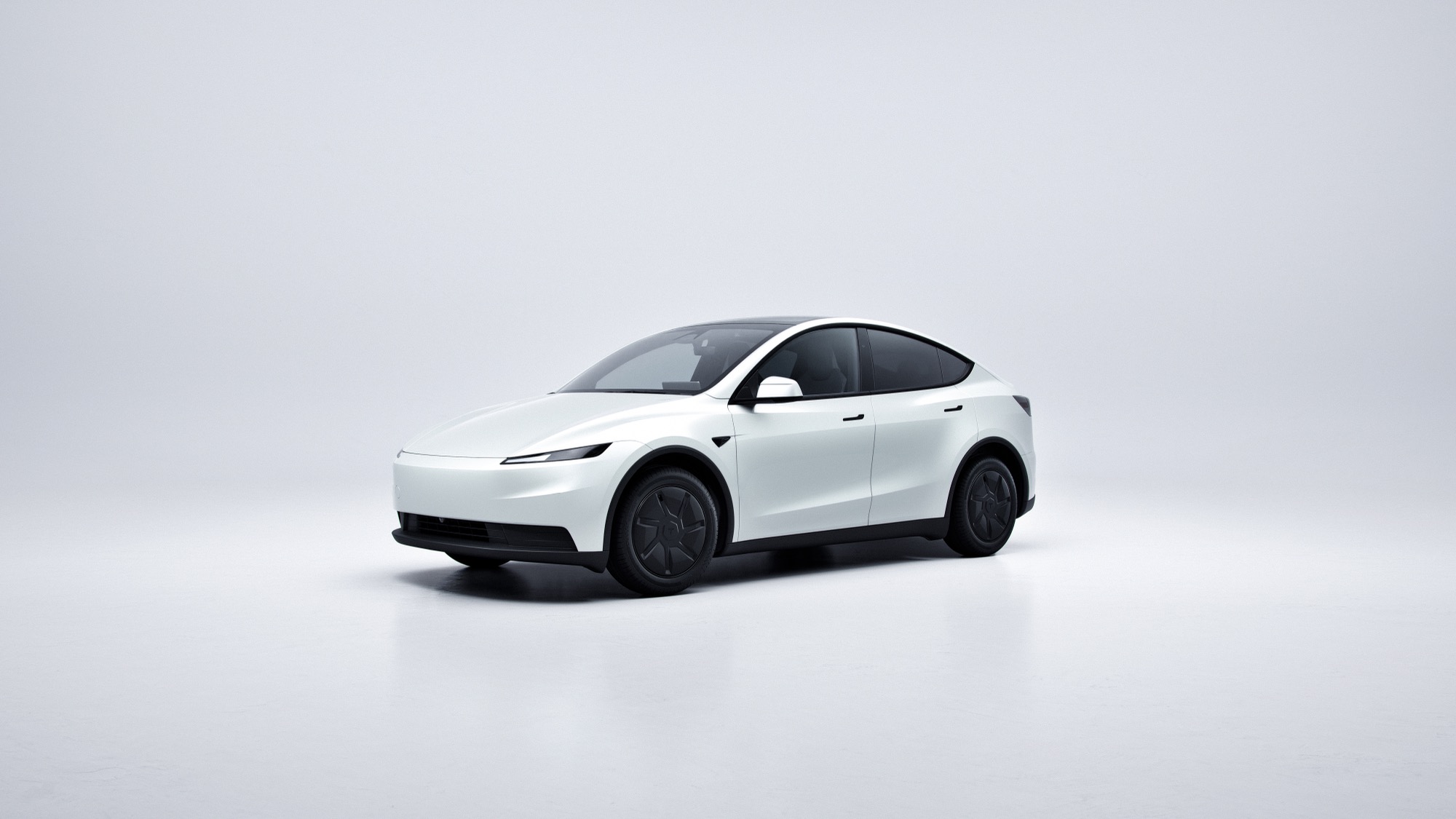 A white 2026 Tesla Model Y in profile on a white studio background