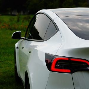 A white Tesla Model Y, one of the two models gaining three selectable traction control modes in the 2026 Summer Update