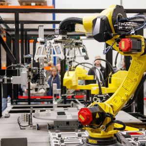 Yellow industrial robot arms on a manufacturing line, the kind of assembly-line equipment Toyota plans to simulate with Nvidia digital twins