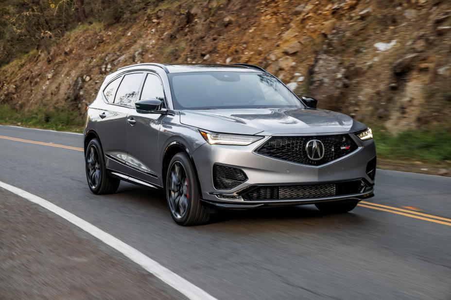 137,329 Acuras Can Lose All-Wheel Drive. NHTSA Says That Isn't a Defect. 2 2023 Acura MDX Type S in silver driving on a two-lane road, front three-quarter view