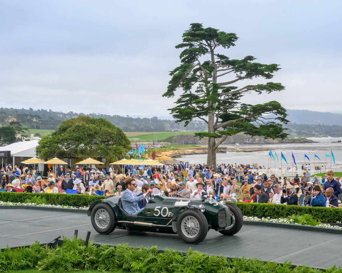 Both Ken Miles Specials Return to the Course That Disqualified Him in 1952 5 Green MG R1 Ken Miles Special racing car number 50F on the Pebble Beach awards ramp in 2026