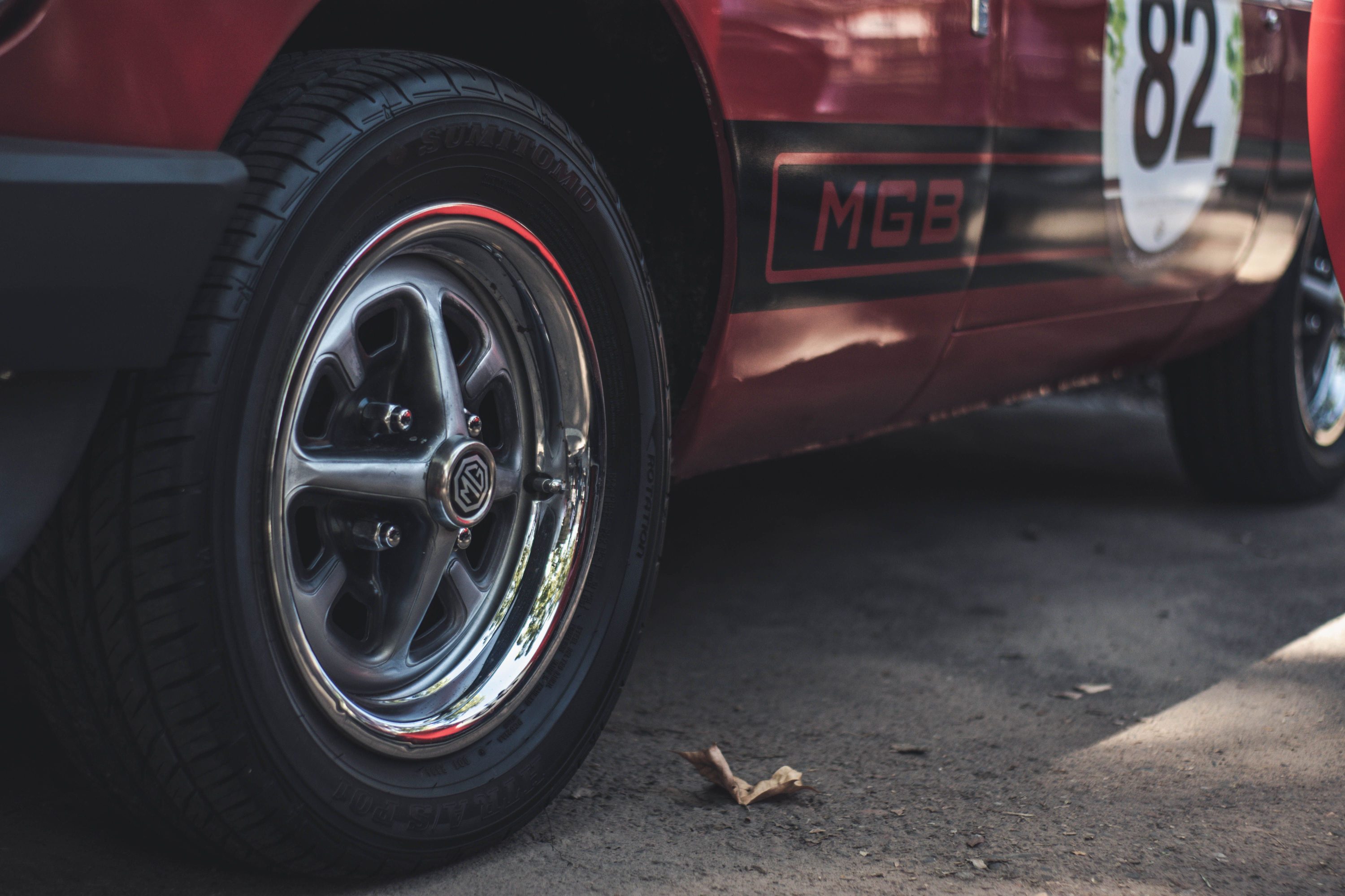 Close-up of the wheel and side of a vintage MG sports car