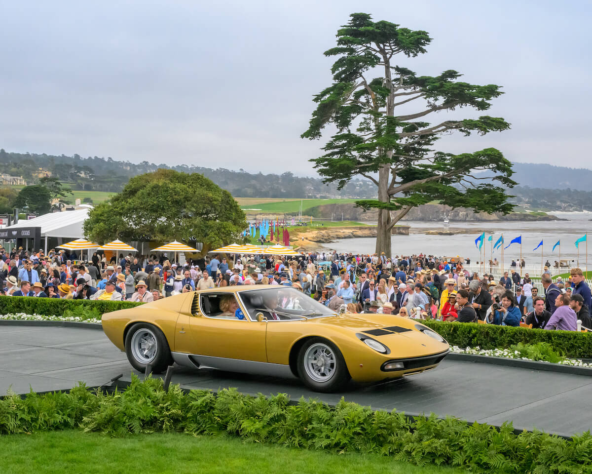 Gold 1972 Lamborghini Miura P400 SV on the Pebble Beach awards ramp in 2026