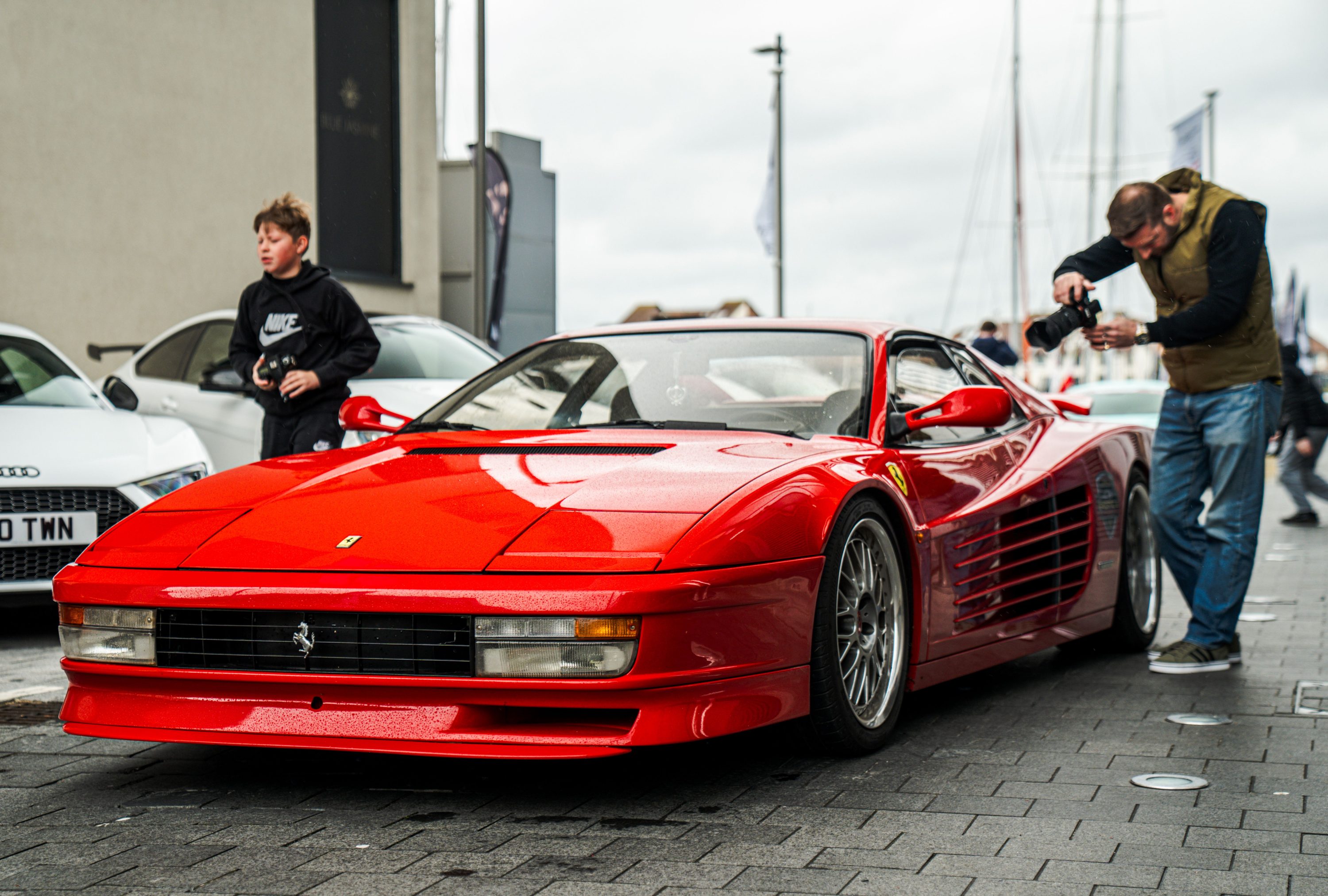 Red Ferrari Testarossa parked on a street