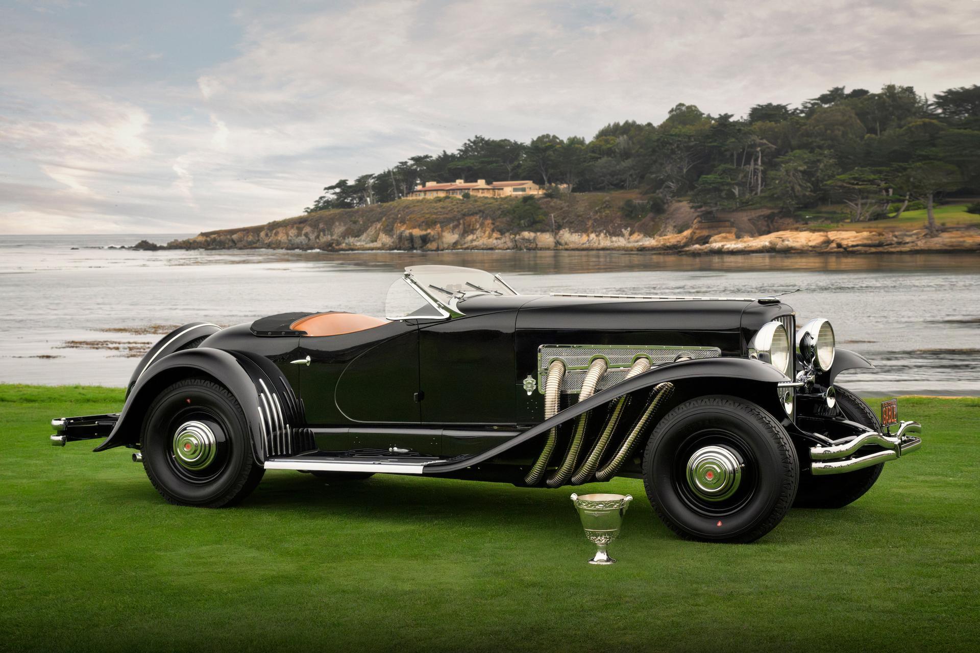 Duesenberg SSJ Special Speedster on the awards ramp at Pebble Beach with Carmel Bay behind it