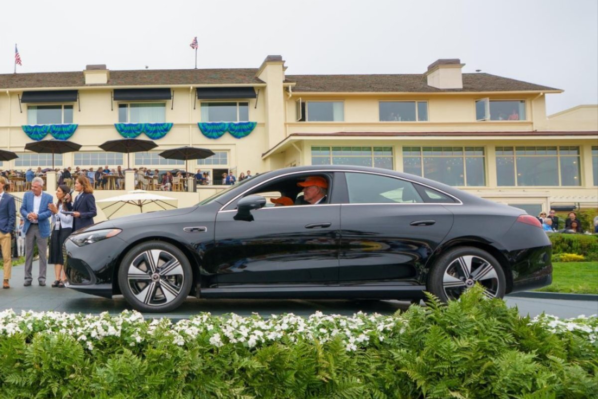 Black Mercedes-Benz EQE sedan presented on the Pebble Beach ramp as a Charity Drawing prize vehicle