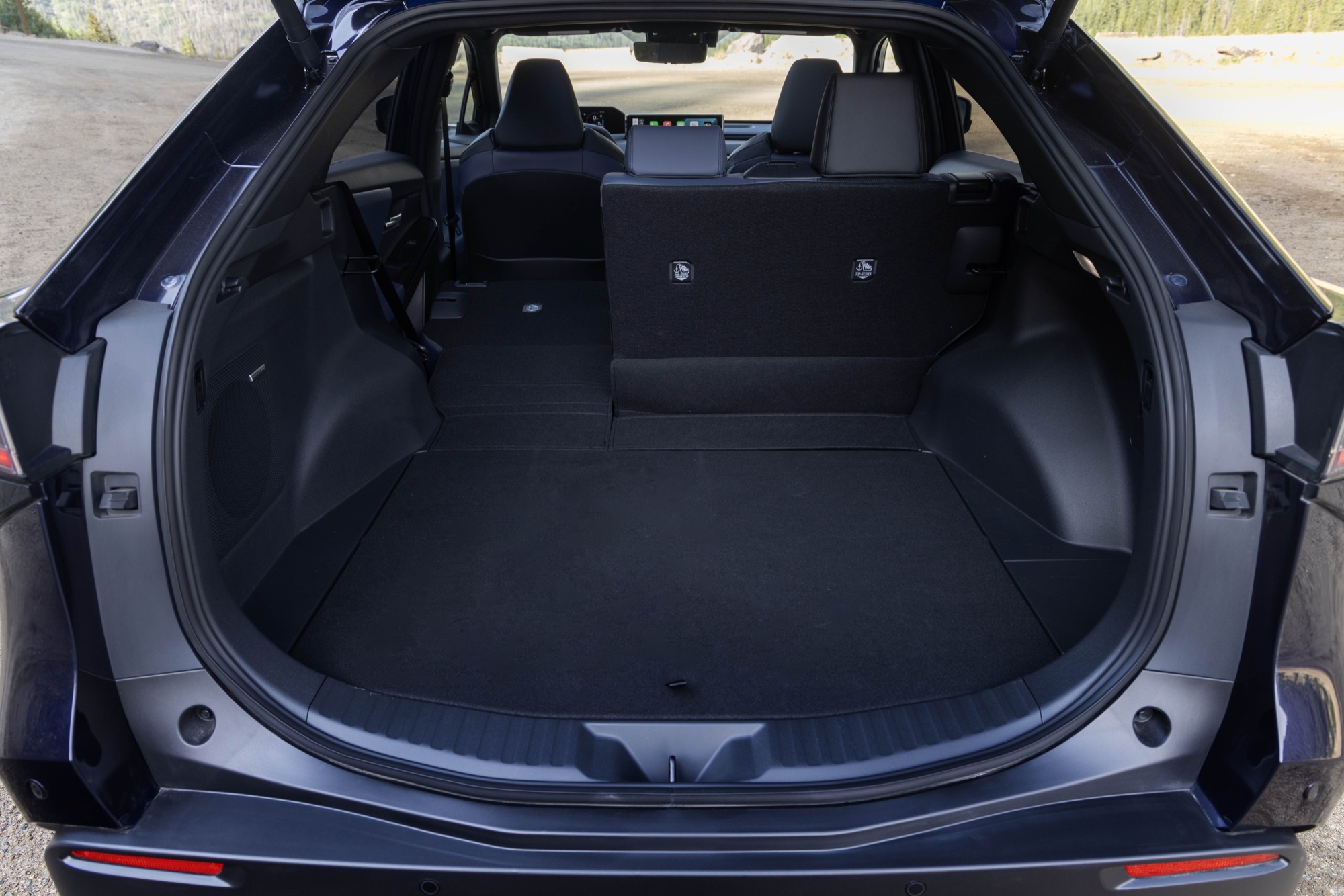Cargo area of a 2026 Subaru Solterra with the rear seats folded flat