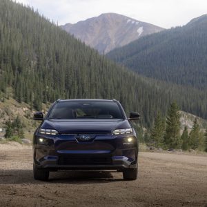 2026 Subaru Solterra electric SUV in blue, front view on a mountain road