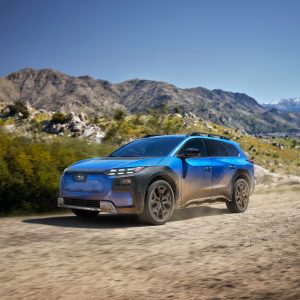 2026 Subaru Trailseeker electric SUV in blue on a mountain road, front three-quarter view