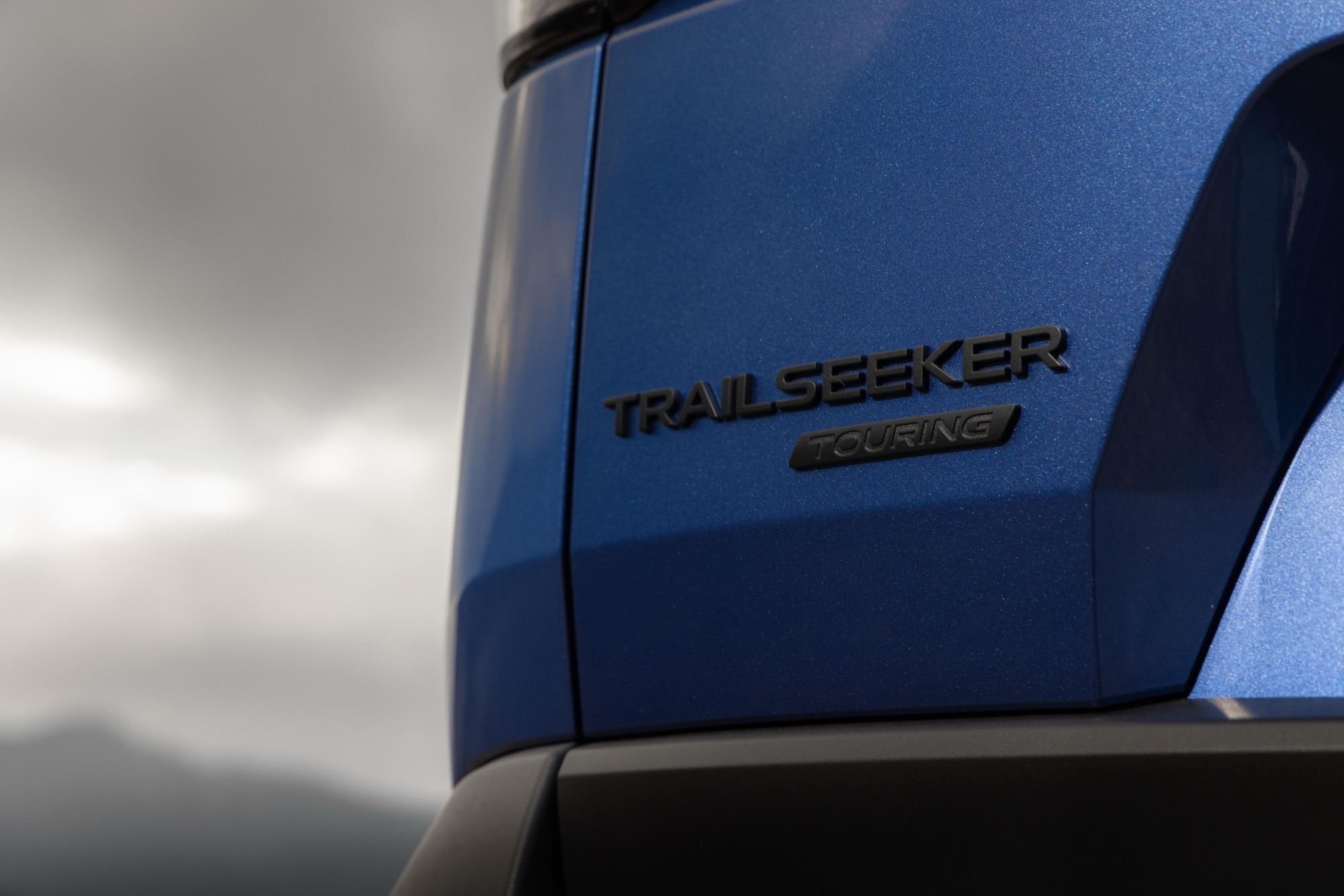 TRAILSEEKER TOURING badge on the rear quarter panel of a blue 2026 Subaru Trailseeker