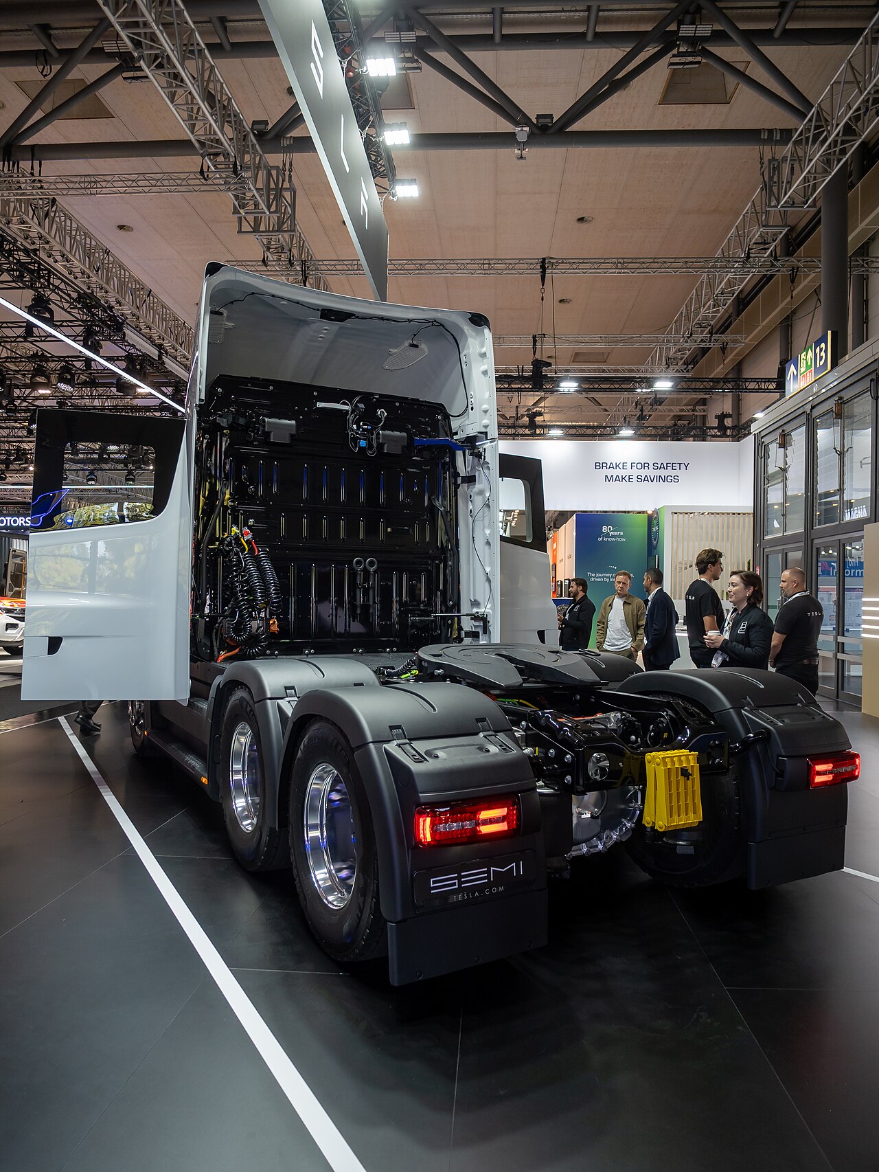 Rear view of a white European-specification Tesla Semi tractor on display at IAA Transportation 2026 in Hanover, showing its tandem drive axles and fifth wheel