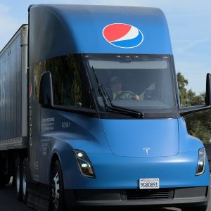 PepsiCo-liveried Tesla Semi pulling a Pepsi trailer on a freeway near Sacramento, California