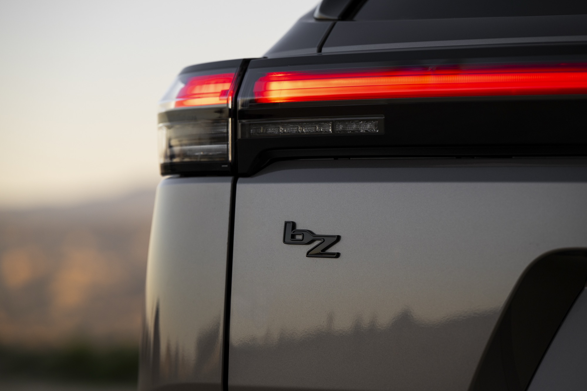 Close-up of the bZ badge on the rear of a 2026 Toyota bZ Woodland
