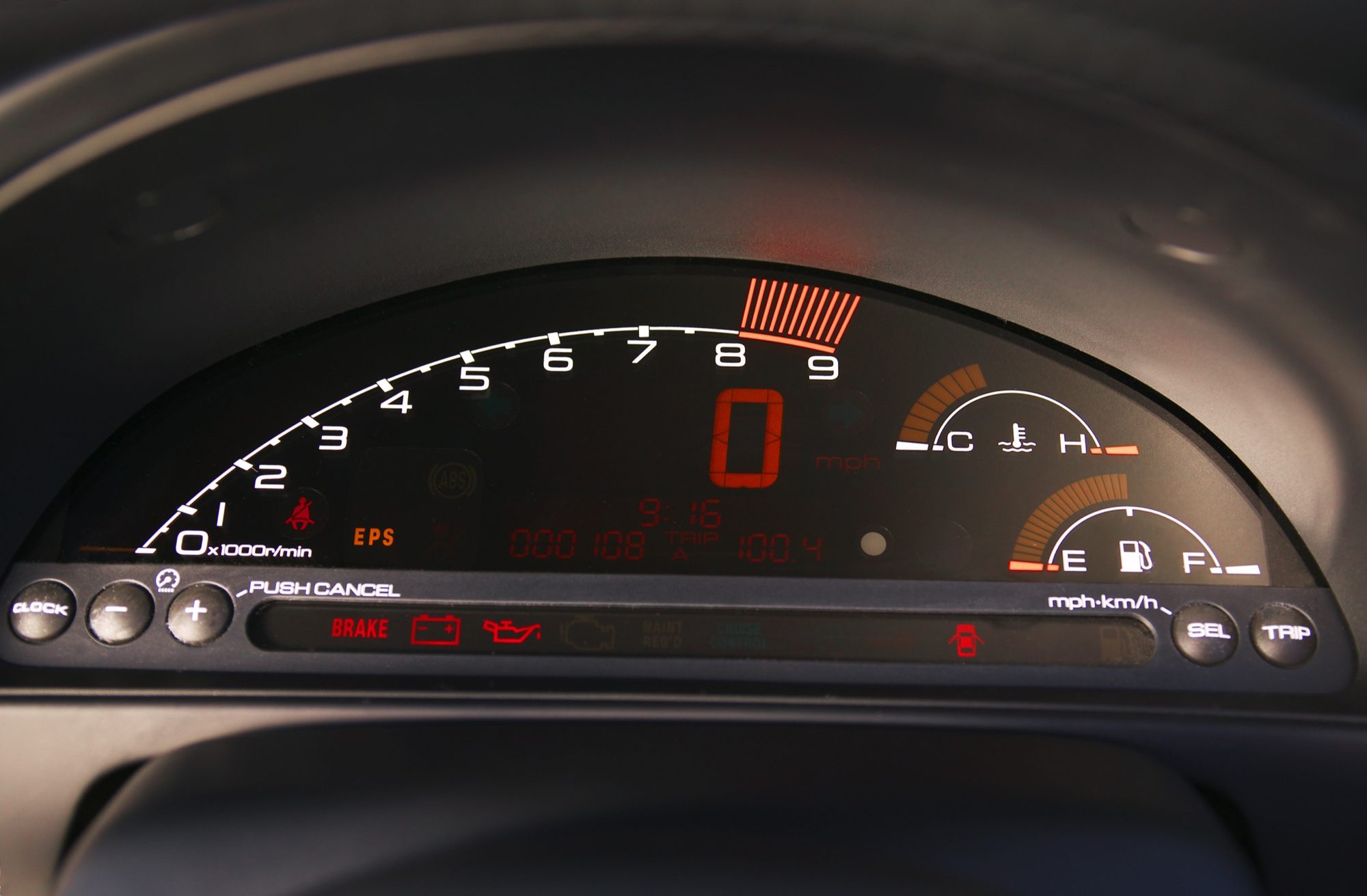Digital instrument cluster of the 2004 Honda S2000 with its bar-graph tachometer and digital speed readout