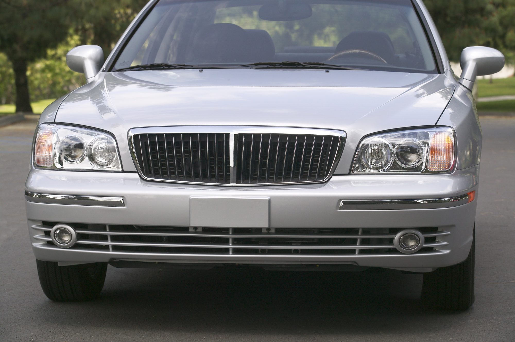 Head-on view of a silver 2004 Hyundai XG350 showing its vertical-bar grille and headlights